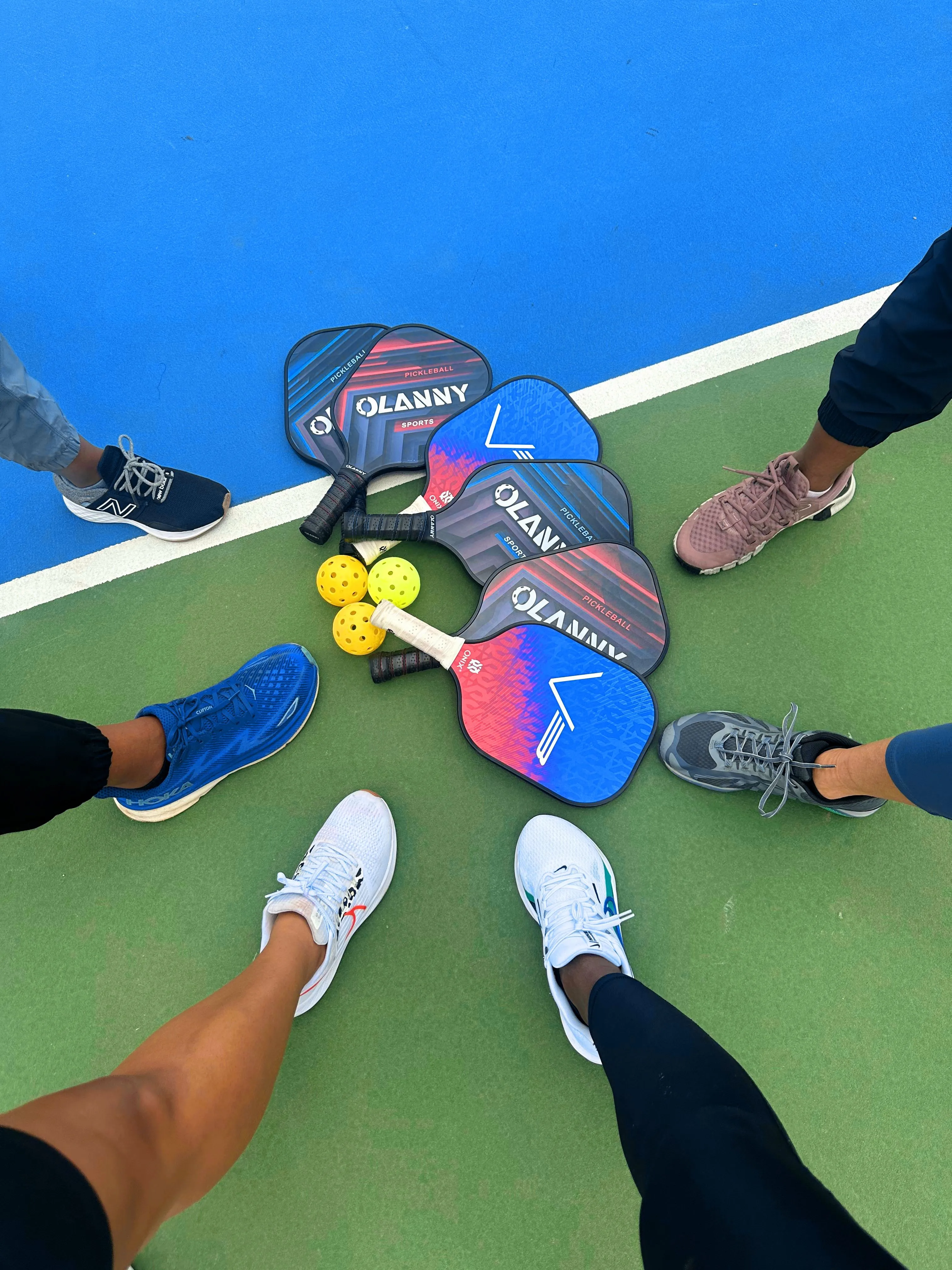 Friends playing pickleball on an outdoor court